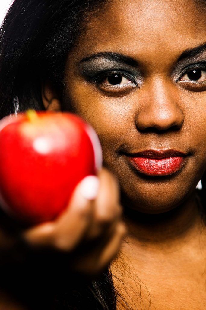 HodgeonRepeat blog - woman offering red apple